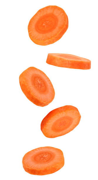 istock flying or falling pieces of carrots 1395834442