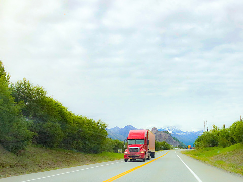 Trucking in Alaska comes with amazing scenery and travel challenges. On this day in late Spring, the truck traveled with ease towards Interior Alaska. The beauty of the lush foliage adds to the beauty of the drive.