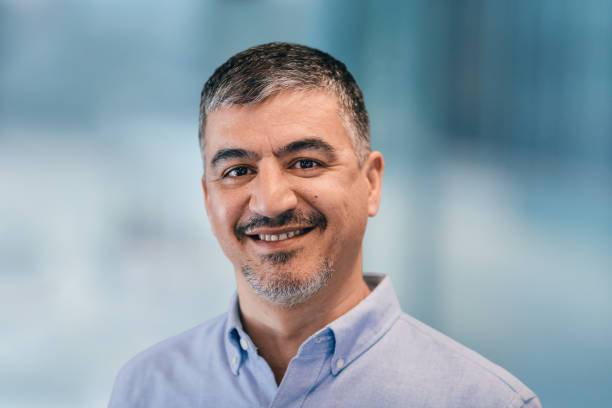 istock Portrait of Asian Middle Eastern man in office setting 1395837957