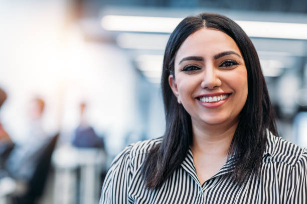 Portrait of Indian young woman in office stock photo