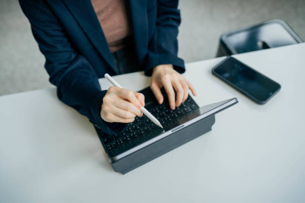istock Asian woman working laptop at cafe. 1395840095
