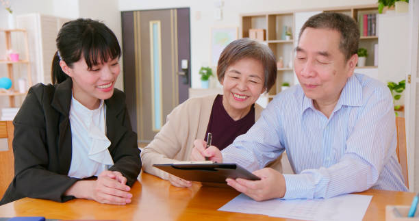 istock asian elderly couple buy house 1395844176