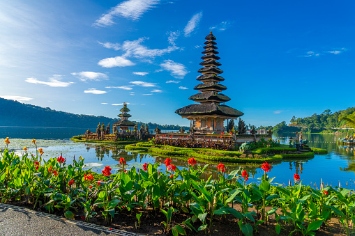 Pura Ulun Danu, Hindu temple surrounded by flowers on Bratan lake, Bali.