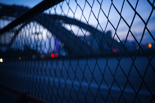 The city fence on the bridge at dusk