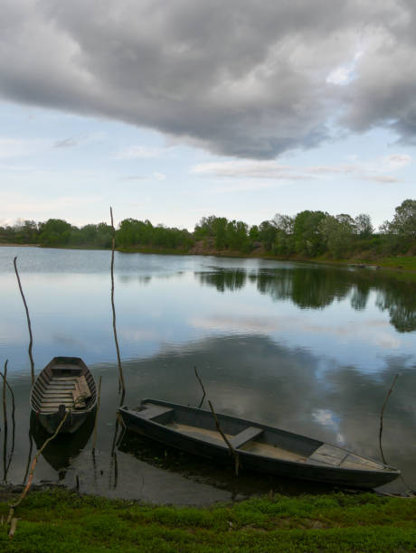 rain drops and cloudstorm over the Po river in Piacenza, Emilia Romagna, Italy at sunset