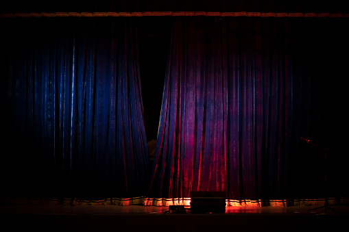 Curtain on stage. Closing curtain after performance. Concert background.