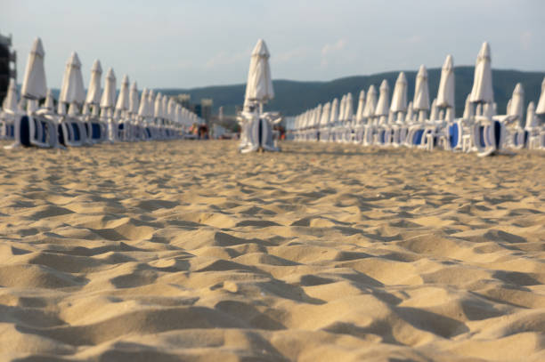 Beach with umbrellas and sun loungers