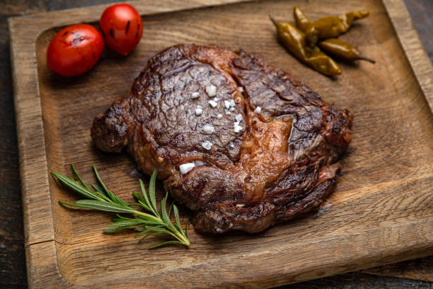 istock grilled meat steak on a wooden board with spices 1395851941