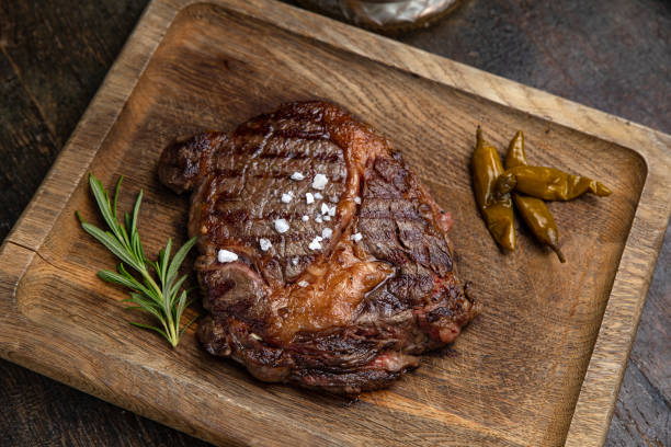istock grilled meat steak on a wooden board with spices 1395852322