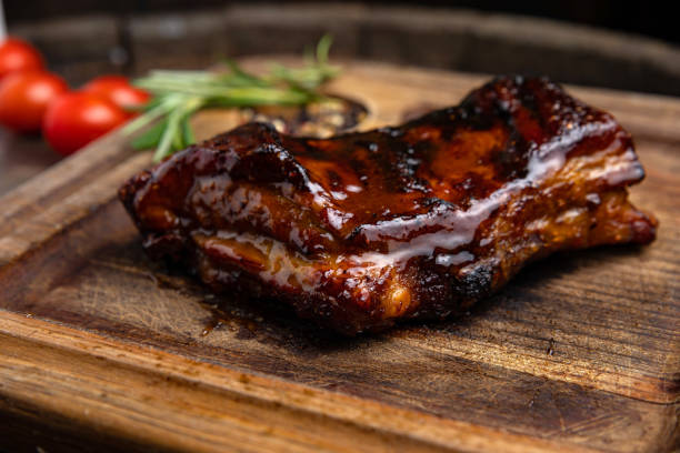 istock grilled meat steak on a wooden board with spices 1395852575