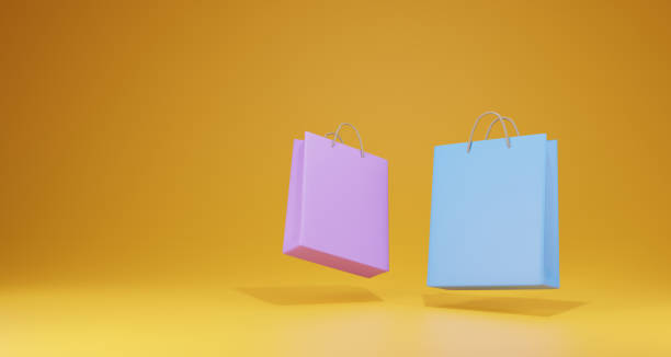 istock 3D paper bag on yellow background. Online shopping concept. 3D render. 1395853407