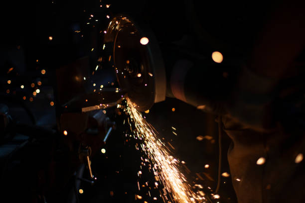 istock Work as grinder in workshop. Metal grinding. Sparks from high temperature. 1395855611