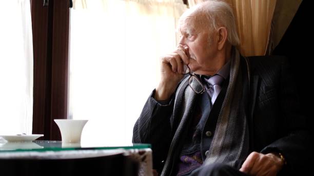 istock Senior retiree has severe migraine attack. Exhausted elderly man suffering from headache 1395860748