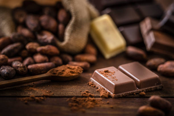 istock Piece of chocolate bar on a rustic wooden table 1395862584