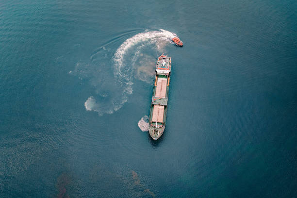 istock Coal ship entering port. 1395862722