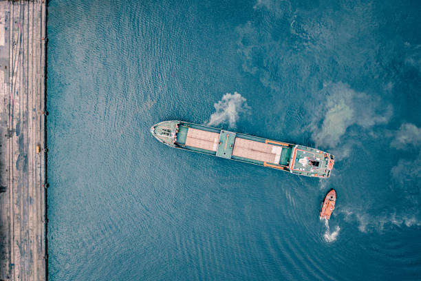 istock Coal ship entering port. 1395862723
