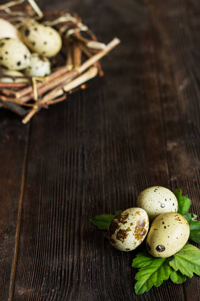 istock Quail eggs on the wooden table. 1395864097