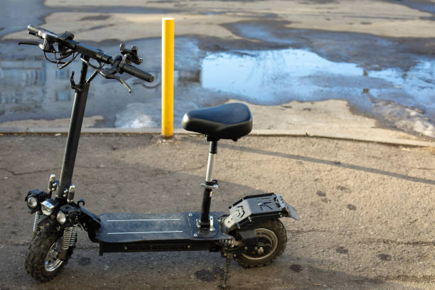 istock Electric scooter on street. Transport on two wheels. 1395864452