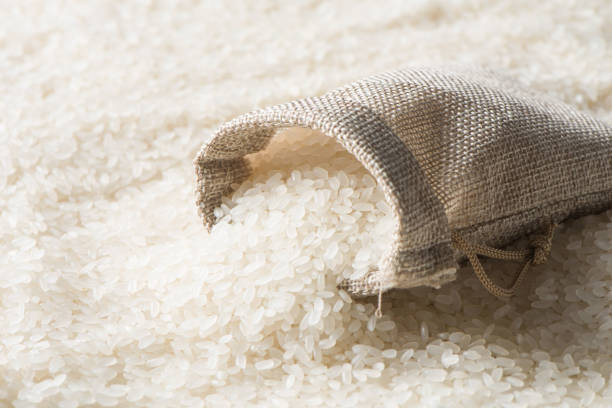 istock rice seed in fabric bag close up. Agricultural concept. 1395868587