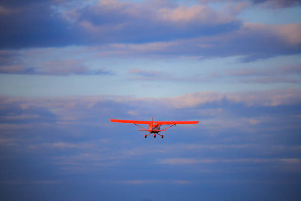 istock Small private propeller plane flies in the sky 1395869695