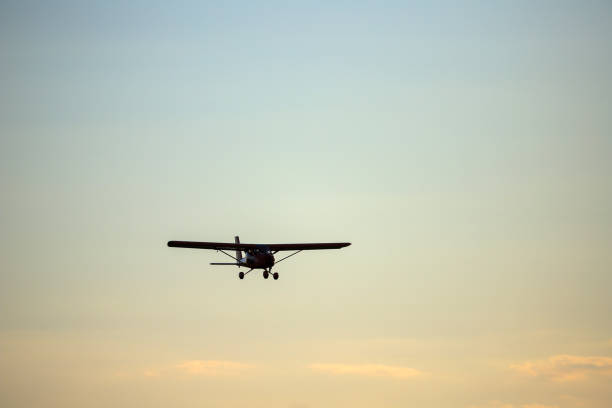 istock Small private propeller plane flies in the sky 1395869702