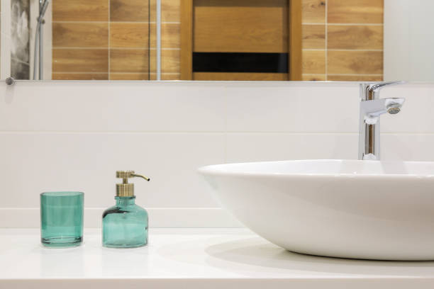 istock Modern white bathroom sink with faucet 1395870011