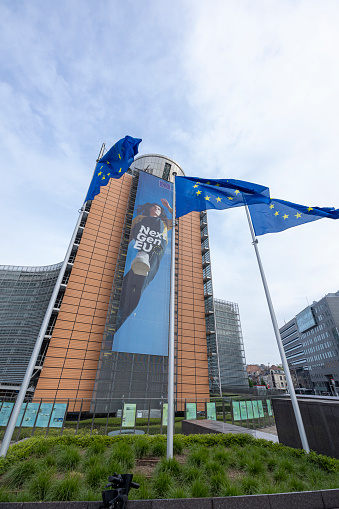 BRUSSELS, Belgium -May 7, 2022: European flags blowing in front of the seat of the European Commission