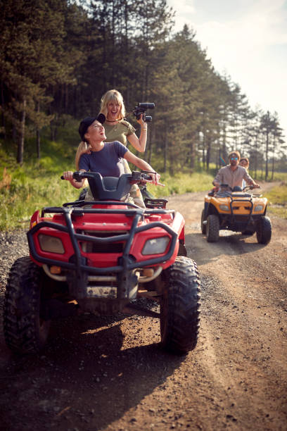 istock Girls driving a off road buggy car 1395873403