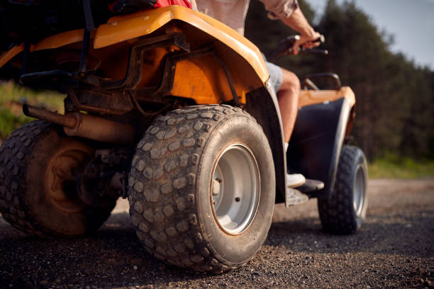 istock Two avanturistic friends driving quad together 1395874984