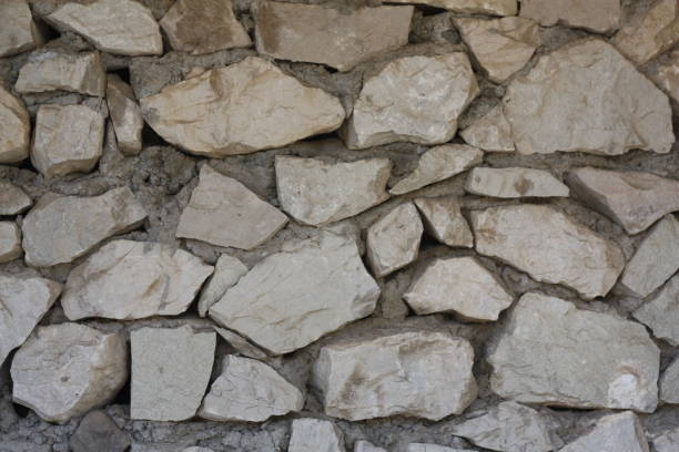 istock The wall is made of wild stone. 1395875185
