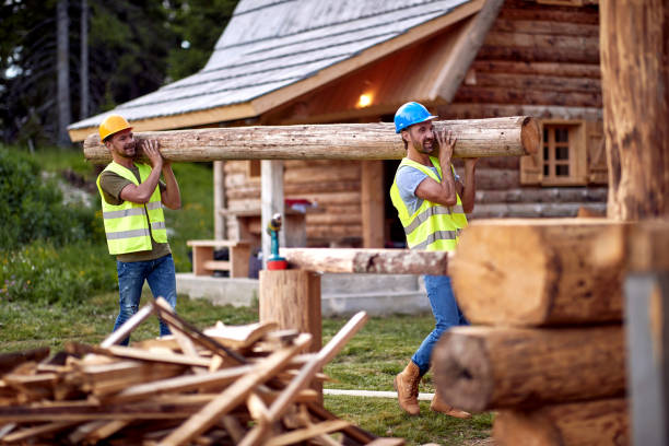 istock Teamwork .carpenters holds wooden planks on construction site 1395875426