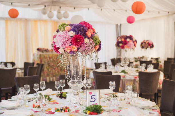 istock Wedding floral decoration on the guest table before reception. 1395877299