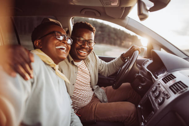 Selfie Smiling young couple taking selfie in car during sunset black couple sunset stock pictures, royalty-free photos & images