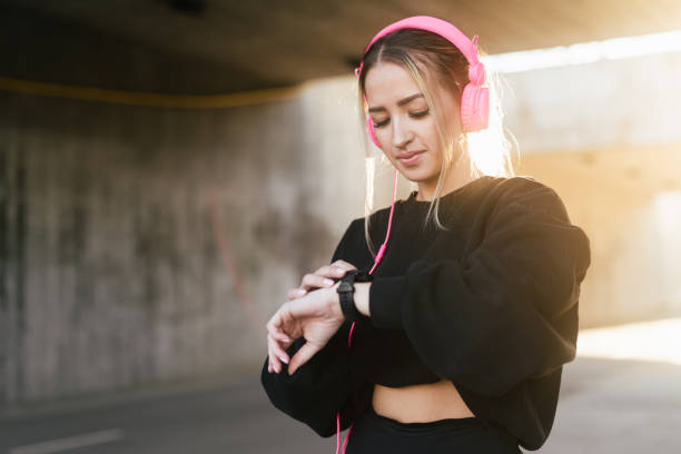 istock Woman checking smartwatch during workout 1395880568