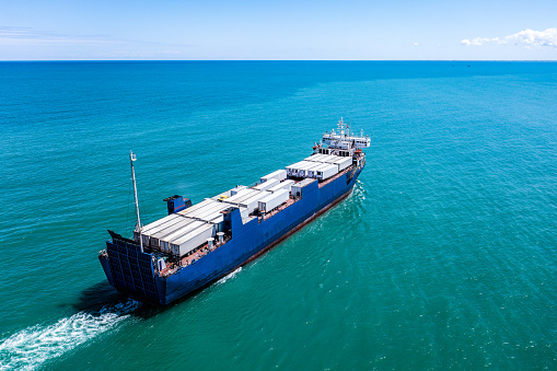 Aerial view of a Large RoRo (Roll on/off) Vehicle carrier cruising the Mediterranean sea.
