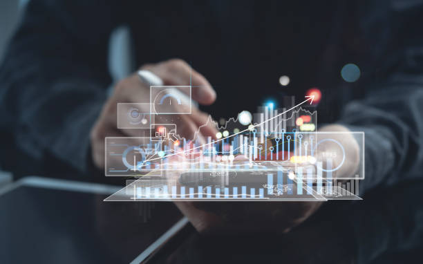 istock Businessman using digital tablet analyzing sales data with financial trading graph and economic growth report on virtual screen 1395883672
