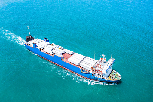 Aerial view of a Large RoRo (Roll on/off) Vehicle carrier cruising the Mediterranean sea.