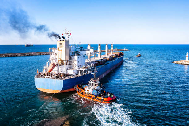 istock Aerial view of cargo ship leaving port. 1395885331