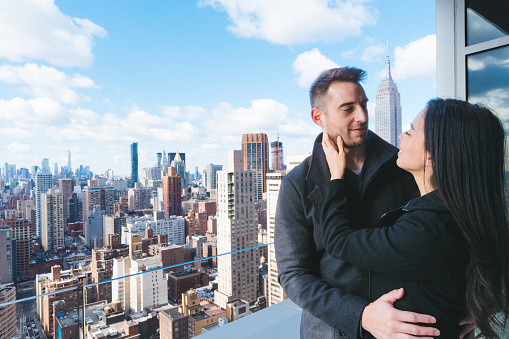 Couple photographed at Manhattan high-rise