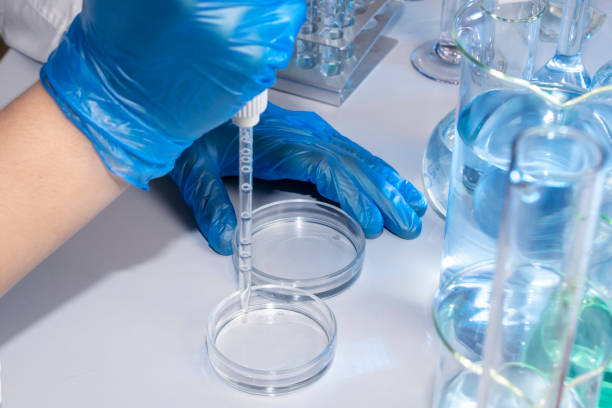 istock Hand of a scientist taking samples with a pipette 1395889369