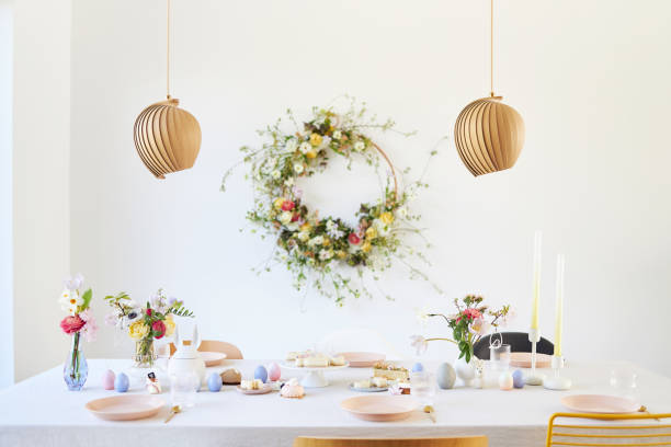 istock A modern table decoration as an Easter table with a floral Easter wreath hanging on the wall 1395890322