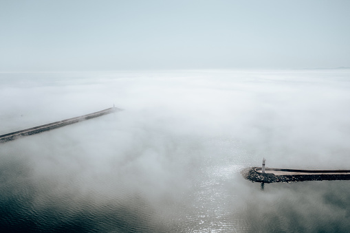 Clouds over sea. Foggy weather over sea. Top view of sea. Aerial view. Sea mist