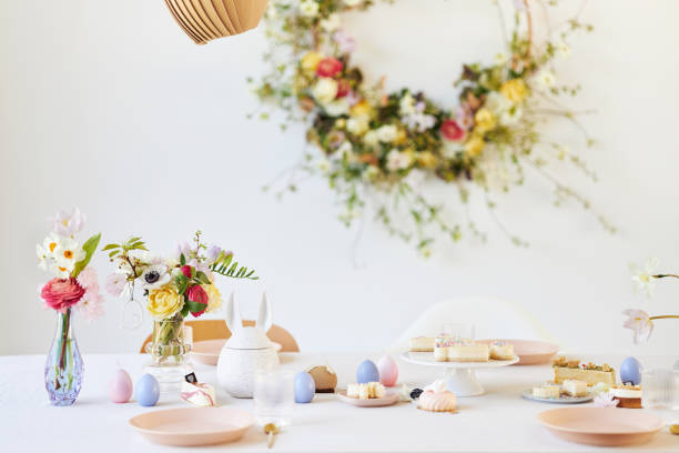 istock A modern table decoration as an Easter table with a floral Easter wreath hanging on the wall 1395890528