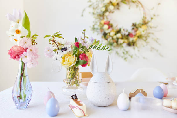 istock A modern table decoration as an Easter table with a floral Easter wreath hanging on the wall 1395890592