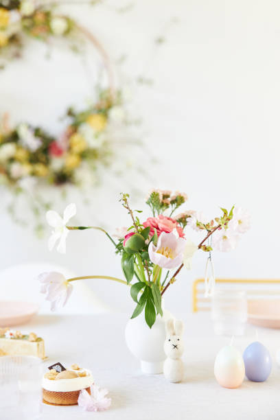 istock A modern table decoration as an Easter table with a floral Easter wreath hanging on the wall 1395891257