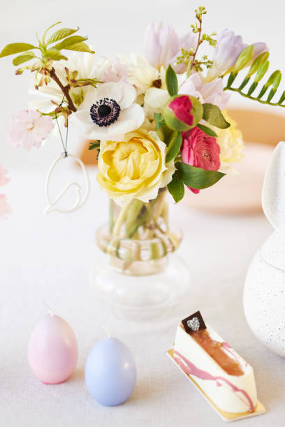 istock A modern table decoration as an Easter table with a floral Easter wreath hanging on the wall 1395891412