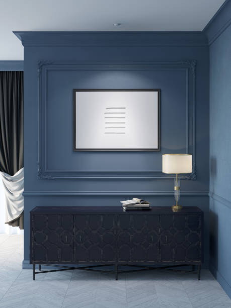 istock Dark blue classic interior with the illuminated horizontal poster on the molded wall, a lamp on the old black chest of drawers, curtained window in the background. Front view. 1395891488