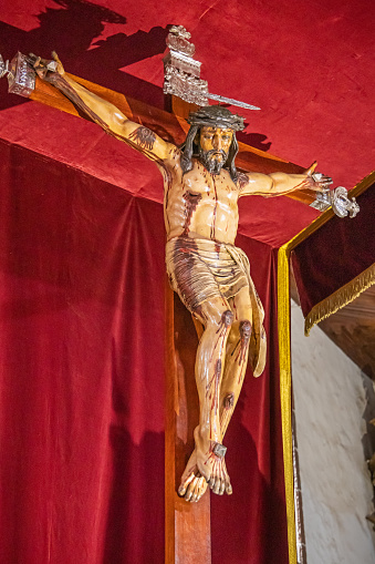 Minsk, Belarus - May 20, 2015: The statue of the crucified Christ on the cross. The Christian cross with Jesus in the Cathedral of Saint Virgin Mary