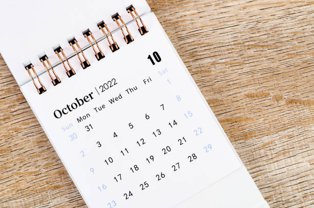 istock October 2022 desk calendar on wooden background. 1395895714