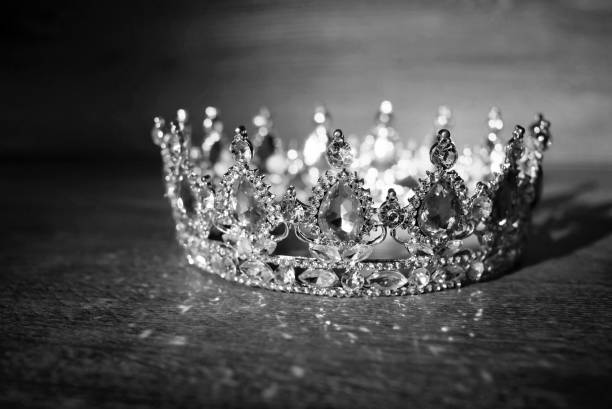 istock Royal golden crown with ruby, garnet gemstones, qrystals. Black and white 1395900119